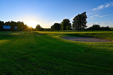 evening light over golf course in Kumla Sweden