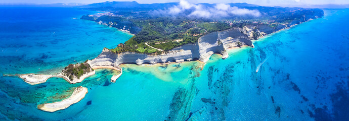 Ionian islands of Greece Corfu. Panoramic aerial view of stunning Cape Drastis - natural beuty landscape with white rocks and turquoise waters - obrazy, fototapety, plakaty