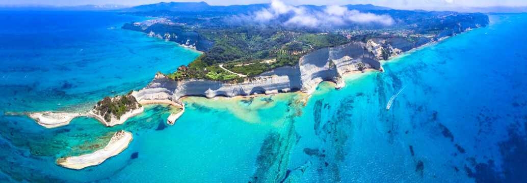 Ionian islands of Greece. Panoramic aerial view of stunning Cape Drastis - natural beuty landscape with white rocks and turquoise waters, northern part of Corfu island.