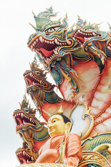 Fototapeta na wymiar Thai serpent dragon statue with buddha statue
