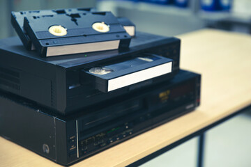 Video cassette tapes VHS in the video tape player and pile stack concept of old retro style or...