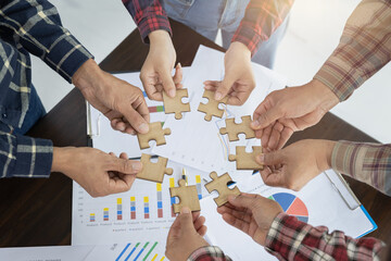 A group of business people assemble jigsaw puzzles, the concept of cooperation, Business teamwork concept, people join for the success of business cooperation.