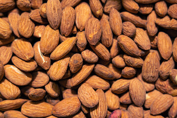 Peeled almond seeds texture closeup. bright shades