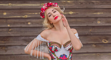 Woman in Slavic ethnic embroidered dress, flower wreath in hair. Concept of beauty Slavic women, Boho style