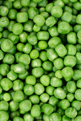 Green peas. Green background. Pea background. View from above. Green pea background. Pea pods from farmland. Pea freshly picked. Organic fresh vegetables. Healthy eating. Country garden harvest.