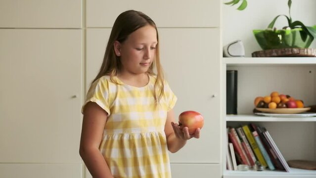 the girl chooses between a cupcake and an apple