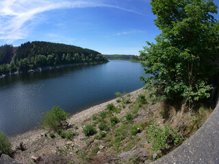 Obraz premium Views of the Okertalsperre in summer in Altenau in the district of Goslar in the state of Lower Saxony..etc. Okertalsperre in different views..