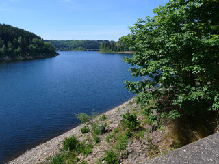 Obraz premium Views of the Okertalsperre in summer in Altenau in the district of Goslar in the state of Lower Saxony..etc. Okertalsperre in different views..