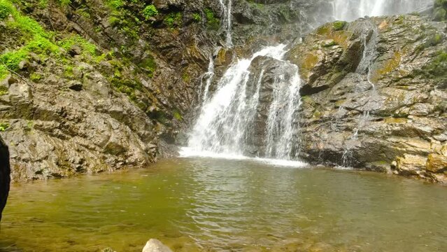 Mervisi waterfall flows into the lake , near Batumi, Georgia, aerial shot. High quality 4k footage