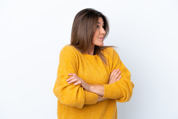 Middle age caucasian woman isolated on white background making doubts gesture while lifting the shoulders