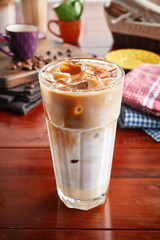 A jar of healthy fresh SPANISH ICED LATTE isolated on wooden background side view