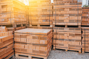 Brick Construction Building. Brick Pallettes in Construction Site. Brick Blocks in Focus.