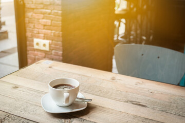 Coffe with milk white cup on caffee table. Morning