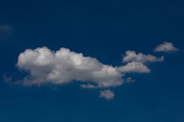 Random shape of cloud on clear blue sky