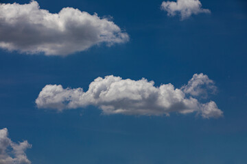 Fototapeta na wymiar Random shape of cloud on clear blue sky