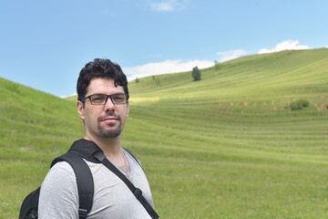 man tourist in glasses in the country.