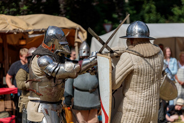 medieval knights in armour fighting