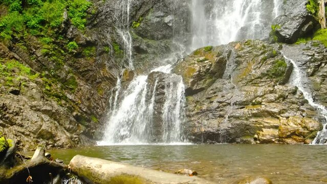 waterfall flows into the lake, aerial shot. High quality 4k footage