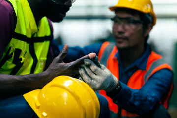 concept of accidents at work Industrial factory. A colleague is caring for a person who has an accident in the factory.