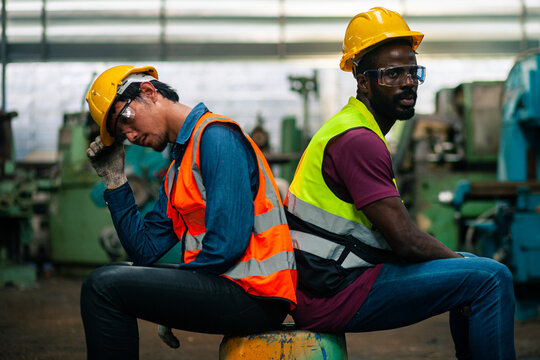 workers or technicians in an industrial plant. Feeling stressed and tired from work. Feeling Stressed. hopeless, burned out, in factory