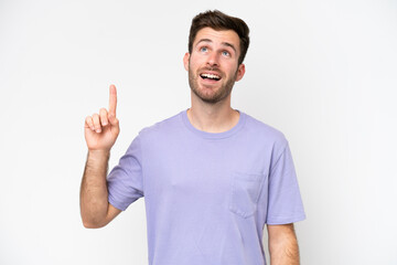 Young caucasian man isolated on white background pointing up and surprised