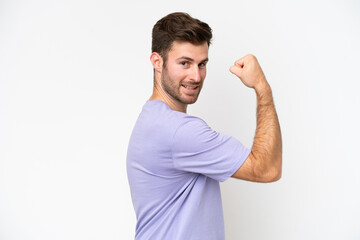 Young caucasian man isolated on white background doing strong gesture