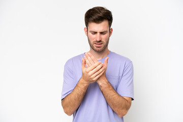 Young caucasian man isolated on white background suffering from pain in hands