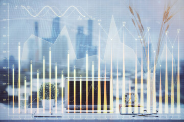 Forex market chart hologram and personal computer background. Double exposure. Concept of investment.