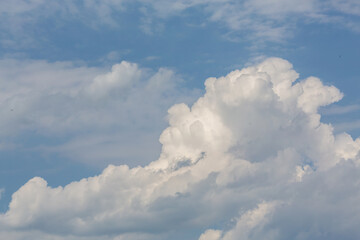 Cumulus clouds in sunny day. Atmosphere background or wallpaper