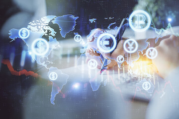Financial forex graph displayed on hands taking notes background. Concept of research. Multi exposure