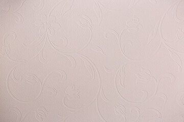 Brown background from decorative plaster with abstract spots. Unusual beige wall texture with beautiful patterns, creative surface background. Front covering for facing of buildings.