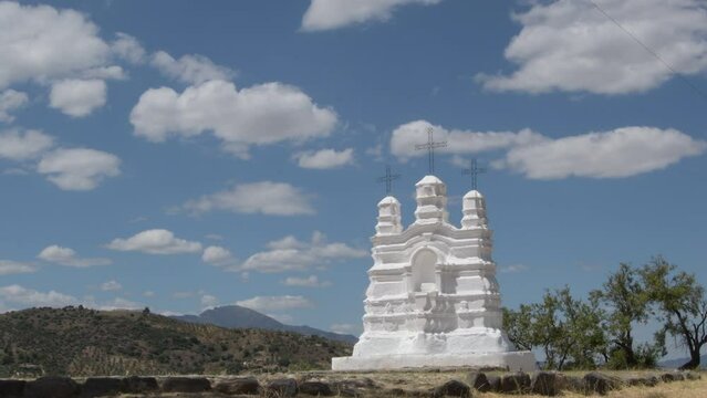 Vicar altar a sunny day with clouds passing. Monda, Malaga, Spain