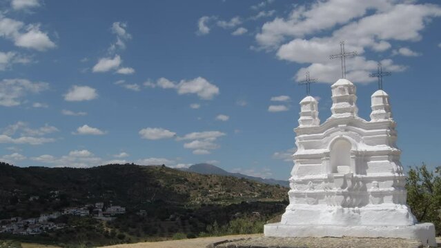 Vicar altar a sunny day with clouds in the sky, religious monument, Monda, Spain