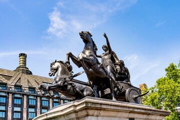 The statue of Boadicea (or Boudicca) and Her Daughters, queen of the British Iceni tribe, by sculptor Thomas Thornycroft, erected on the Victoria Embankment next to Westminster Bridge, London, UK