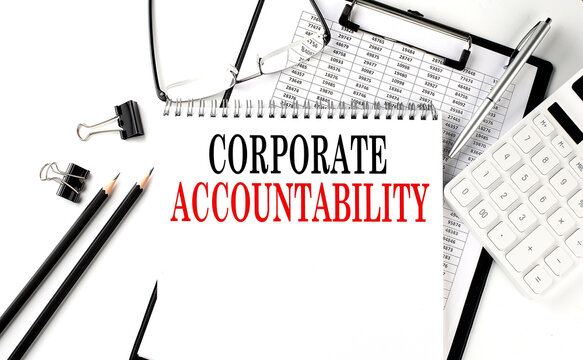 CORPORATE ACCOUNTABILITY word on notepad with clipboard , chart and calculator, business concept