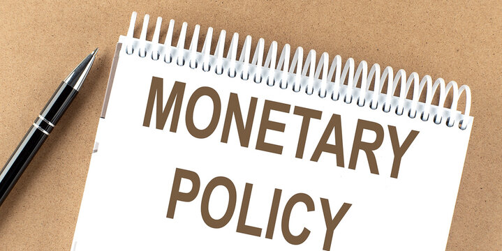 MONETARY POLICY text on a notepad with pen, business