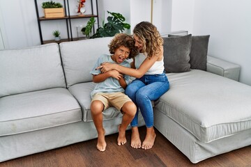 Mother and son smiling confident make tickle at home - obrazy, fototapety, plakaty