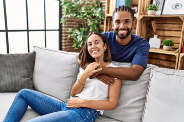 Man and woman couple smiling confident hugging each other at home