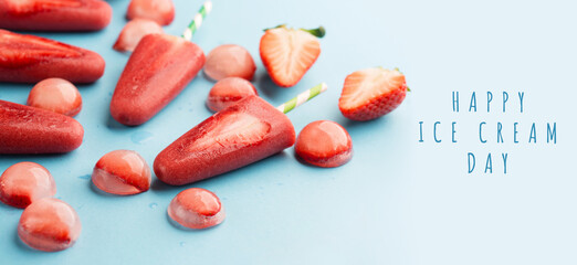 Strawberry popsicles with fresh slices. National ice cream day july 17 holiday concept.