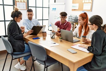 Group of business workers smiling happy working at the office