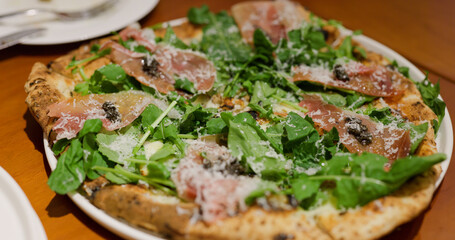 Friends enjoy pizza in restaurant