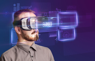 Businessman looking through Virtual Reality glasses, tech concept