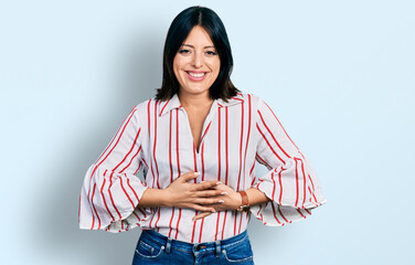 Young hispanic girl wearing casual clothes smiling and laughing hard out loud because funny crazy...