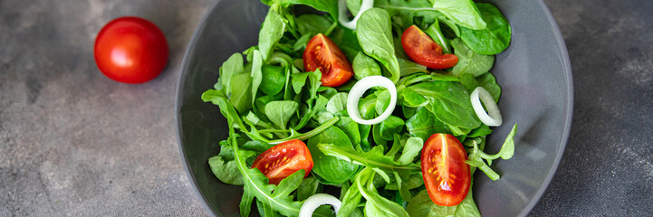 vegetable salad tomato, onion, lettuce mix, mache green fresh healthy meal food snack diet on the...