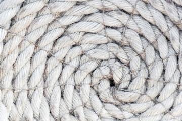 Fototapeta na wymiar Bunch of ship rope circle, jute hemp rope. Weave threads background