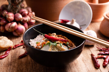 Thai Noodle , Bowl of noodles with spices on wooden background, Thai noodles soup, Table top view