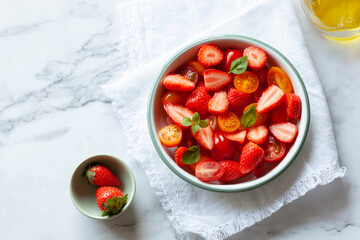 Tomato cherry and strawberry salad, top view