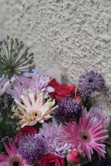 Beautiful spring bouquet in round box. Arrangement with various flowers. The concept of a flower shop. A set of photos for a site or catalogue. Work florist.