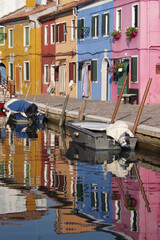 Fototapeta na wymiar colored reflections in the canal in Burano