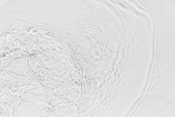 Waves on transparent water surface, gray abstract background.